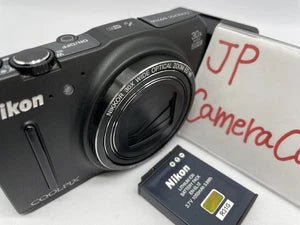 Black Nikon COOLPIX compact digital camera with large front lens and control dial