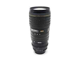 Black telephoto zoom camera lens with extended barrel and glass front element