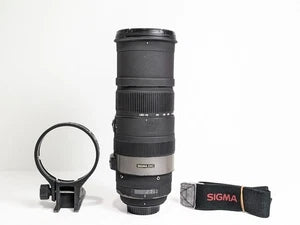 Telephoto camera lens with lens hood and tripod ring, plus Sigma strap pouch