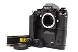 Black Nikon F3 eye-level 35mm SLR film camera body with strap and lens mount