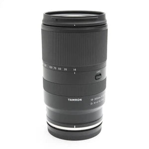 Black zoom camera lens with visible zoom scale and focus markings