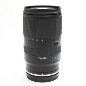 TAMRON black zoom camera lens with front glass and focus/zoom markings