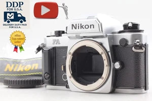 Silver Nikon FA 35mm film SLR camera with lens and top controls